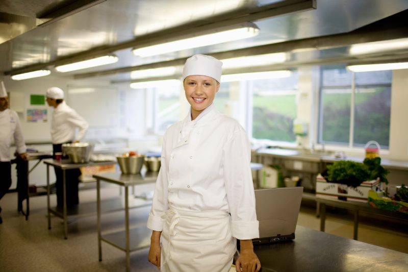 A female chef smiling
